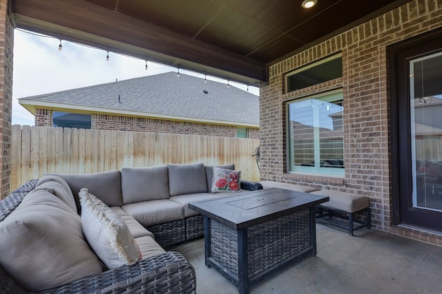 view of patio with an outdoor living space and a fenced backyard