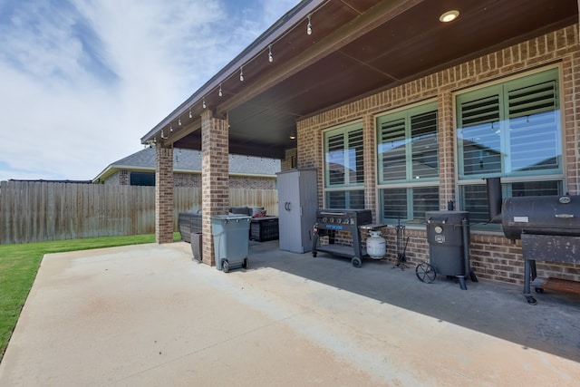view of patio / terrace featuring fence and grilling area