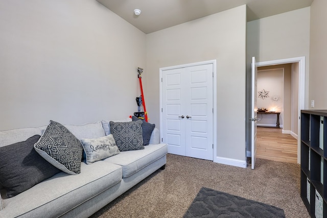 living room with carpet floors and baseboards
