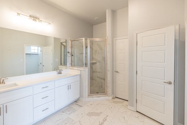 5312 Kilyn Ct, Midland, TX 79703 - bathroom featuring a marble finish shower, marble look tile flooring, double vanity, and baseboards
