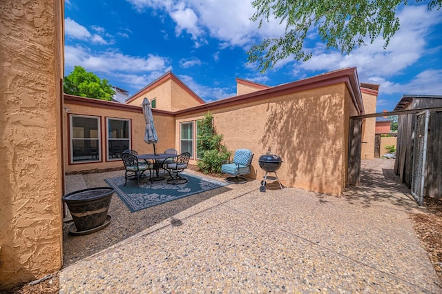 back of property featuring a patio area