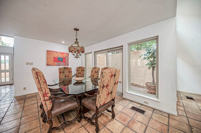 dining space featuring a chandelier