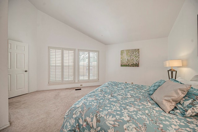 bedroom with carpet and lofted ceiling