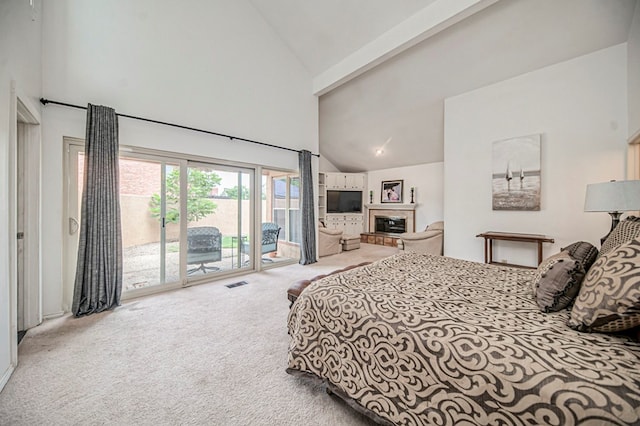 carpeted bedroom featuring access to exterior, beam ceiling, and high vaulted ceiling