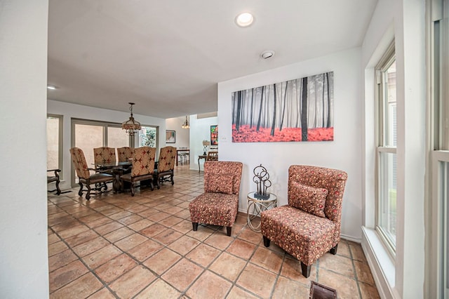 sitting room featuring a chandelier