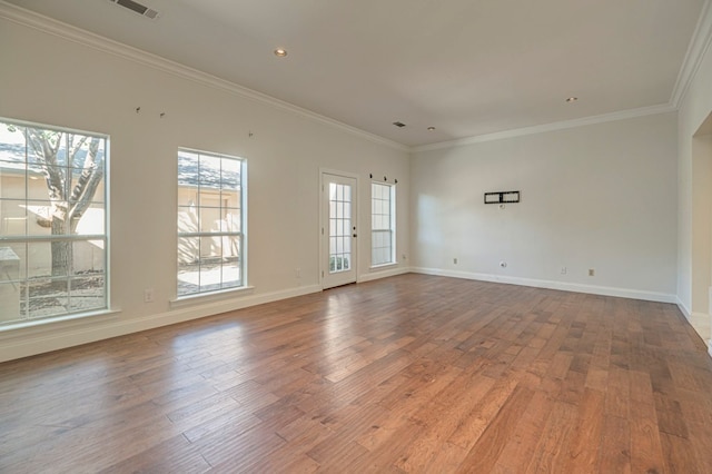 unfurnished room with hardwood / wood-style floors and ornamental molding