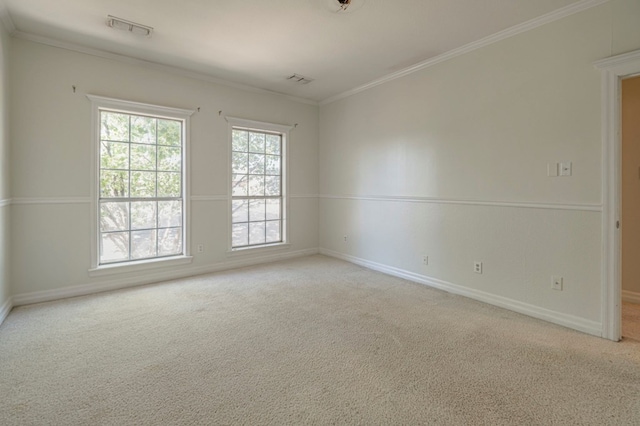 unfurnished room featuring light carpet and ornamental molding