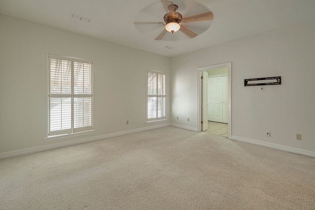 carpeted empty room with ceiling fan