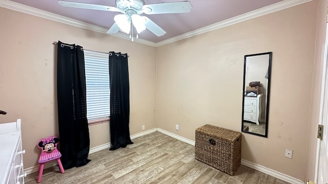 interior space featuring crown molding, ceiling fan, and light hardwood / wood-style floors