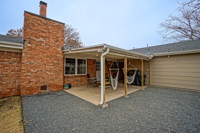 rear view of property with a patio