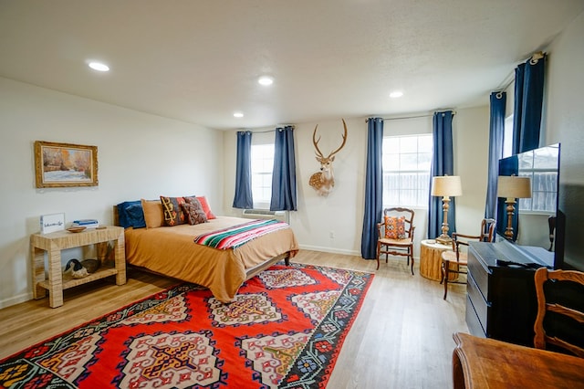 bedroom with light hardwood / wood-style floors