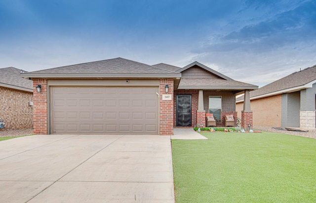 307 Pioneer Cir, Midland, TX 79705 - view of front of home with brick siding, concrete driveway, a front lawn, and covered porch