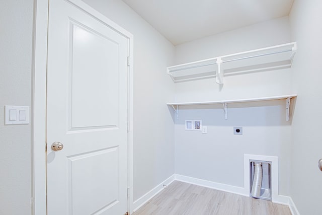 307 Pioneer Cir, Midland, TX 79705 - laundry room featuring hookup for a washing machine, electric dryer hookup, and light wood-type flooring