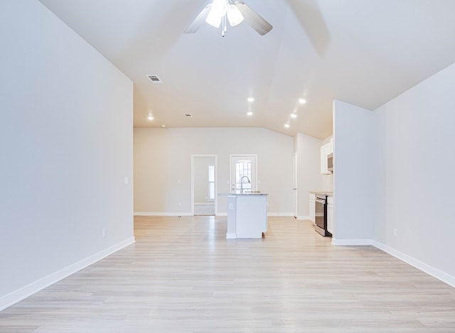307 Pioneer Cir, Midland, TX 79705 - unfurnished living room featuring a ceiling fan, light wood-style floors, lofted ceiling, and recessed lighting