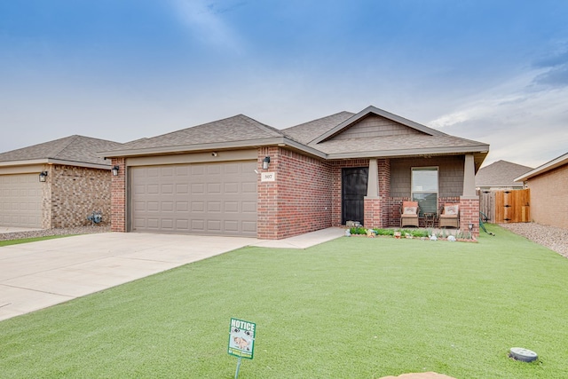 307 Pioneer Cir, Midland, TX 79705 - view of front of property featuring an attached garage, brick siding, concrete driveway, and a shingled roof