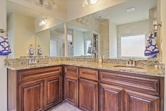 bathroom with vanity and tile patterned floors