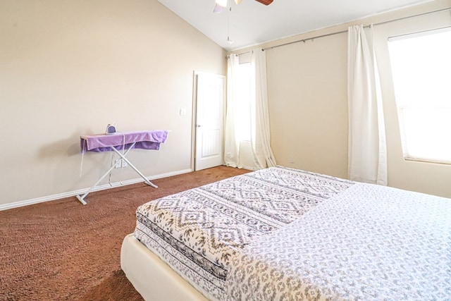 bedroom with carpet flooring, vaulted ceiling, and ceiling fan