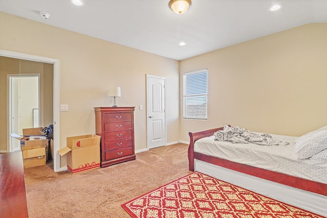 carpeted bedroom featuring vaulted ceiling