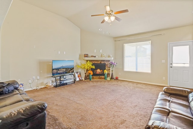 carpeted living room featuring vaulted ceiling and ceiling fan