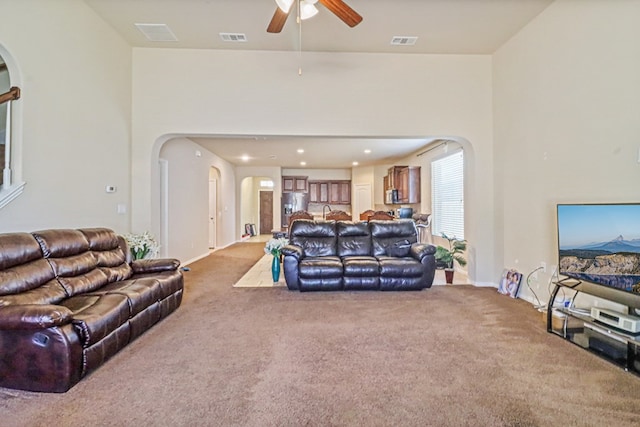 living room with carpet flooring and ceiling fan