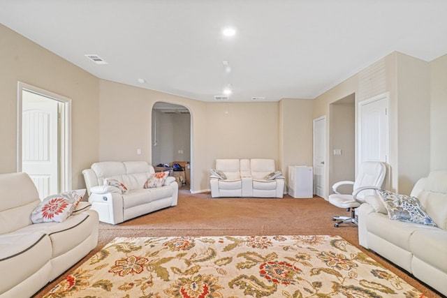 living room featuring light carpet