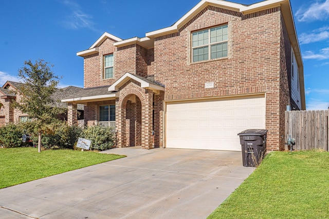 view of front of house with a front lawn and a garage