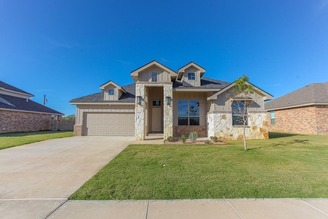 view of front of house featuring a garage and a front yard