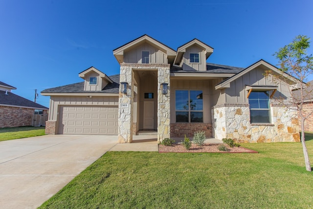 view of front of house featuring a garage and a front yard