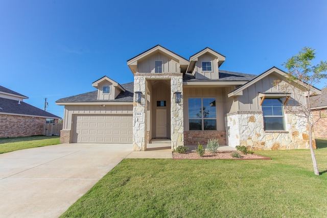 view of front of house with a garage and a front lawn