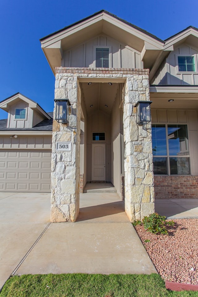 view of exterior entry featuring a garage