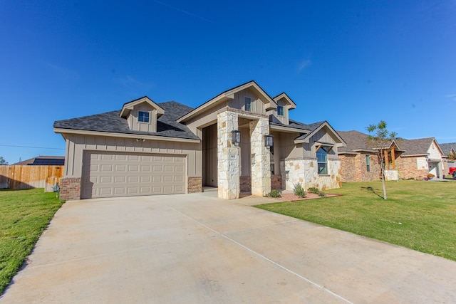 view of front facade with a garage and a front lawn