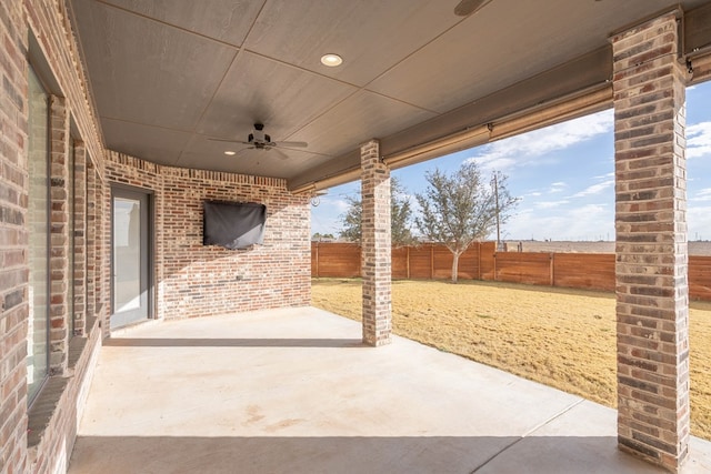 view of patio featuring ceiling fan