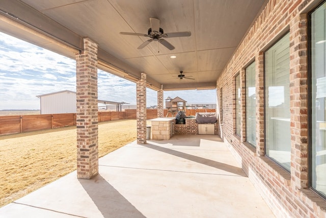 view of patio featuring ceiling fan