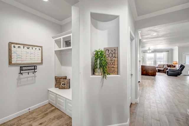 mudroom featuring light wood-type flooring, ceiling fan, and crown molding