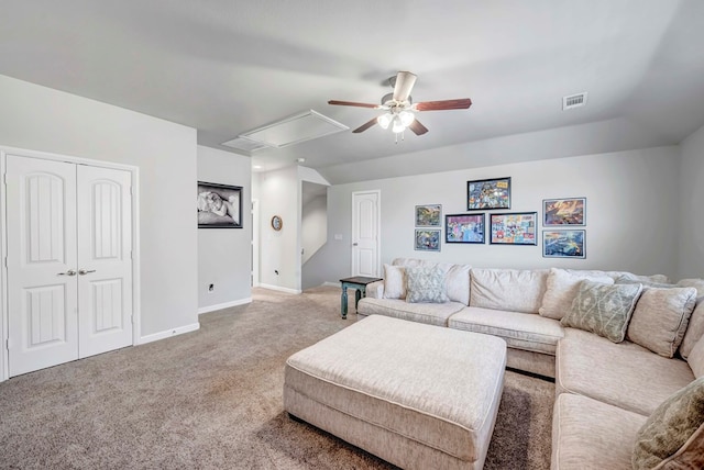 carpeted living room featuring ceiling fan