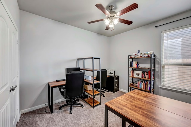 office area with light colored carpet and ceiling fan