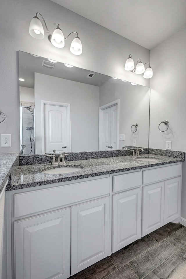 bathroom featuring vanity and walk in shower