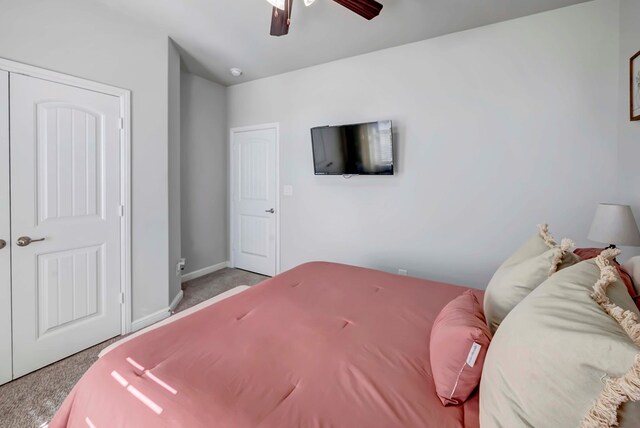 bedroom with ceiling fan and light carpet