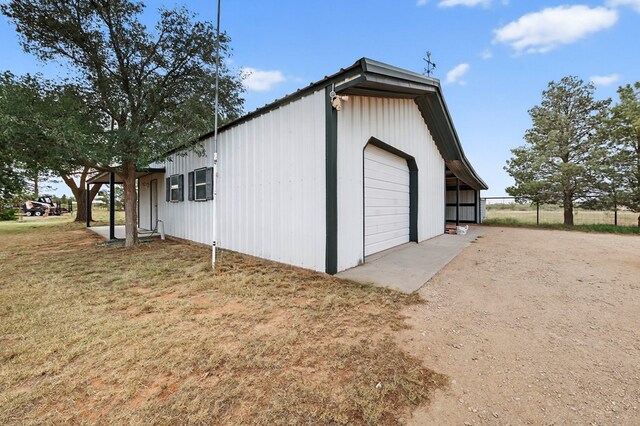 4715 N County Rd 1125, Midland, TX 79705 - detached garage featuring driveway