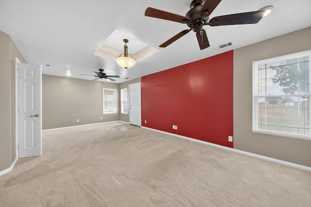 4715 N County Rd 1125, Midland, TX 79705 - spare room featuring a ceiling fan and light carpet