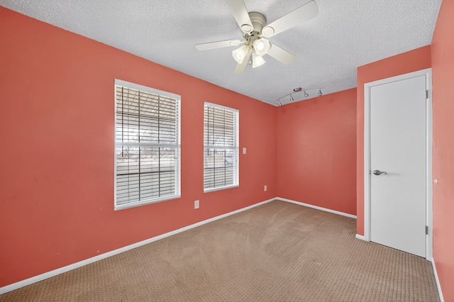 4715 N County Rd 1125, Midland, TX 79705 - carpeted empty room featuring ceiling fan and a textured ceiling