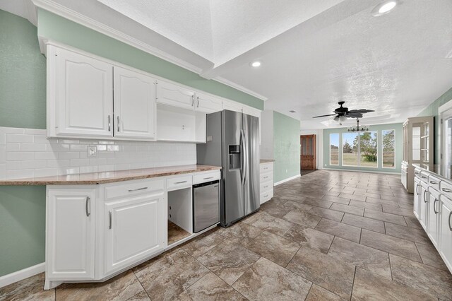 4715 N County Rd 1125, Midland, TX 79705 - kitchen featuring stainless steel refrigerator with ice dispenser, decorative backsplash, a textured ceiling, ceiling fan, and white cabinets