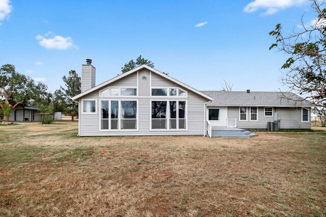 4715 N County Rd 1125, Midland, TX 79705 - rear view of house featuring a chimney and a yard