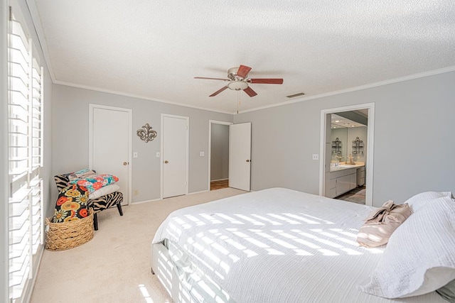 bedroom featuring ceiling fan, light colored carpet, ornamental molding, and a textured ceiling