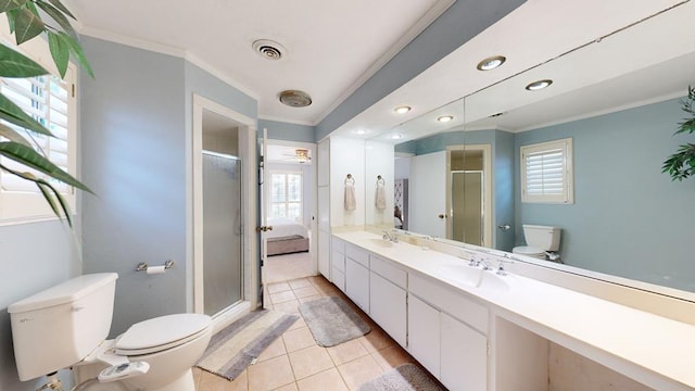 bathroom with a healthy amount of sunlight, ornamental molding, and toilet