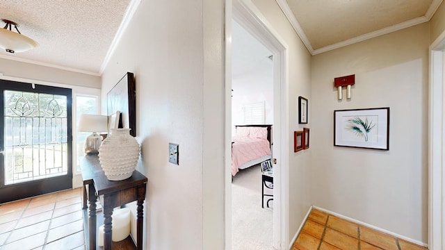 foyer entrance featuring crown molding and a textured ceiling