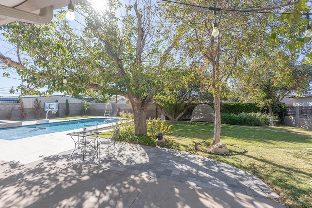 1703 Laurel Ave, Odessa, TX 79761 - view of swimming pool with a water slide, a fenced backyard, and a patio area