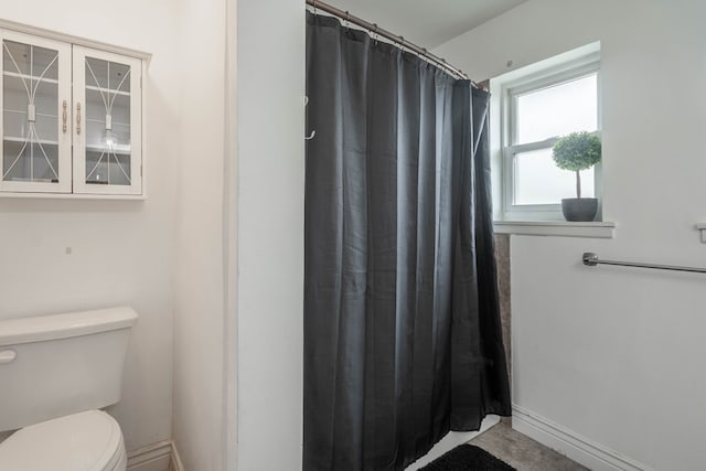 1703 Laurel Ave, Odessa, TX 79761 - bathroom with toilet and curtained shower