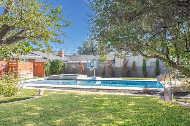 1703 Laurel Ave, Odessa, TX 79761 - view of pool with a fenced backyard, an in-ground hot tub, and a water slide