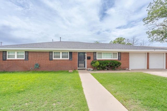 1703 Laurel Ave, Odessa, TX 79761 - ranch-style home featuring an attached garage, a front lawn, concrete driveway, and brick siding